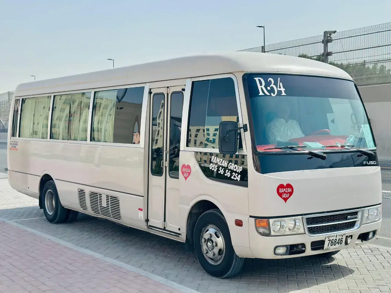 Fleet lineup of Ramzan Group Coaster vans before morning service