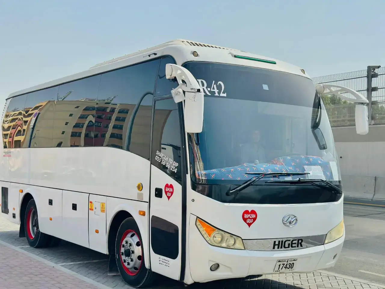 Coaster van operated by Ramzan Group for Sharjah–Dubai commute