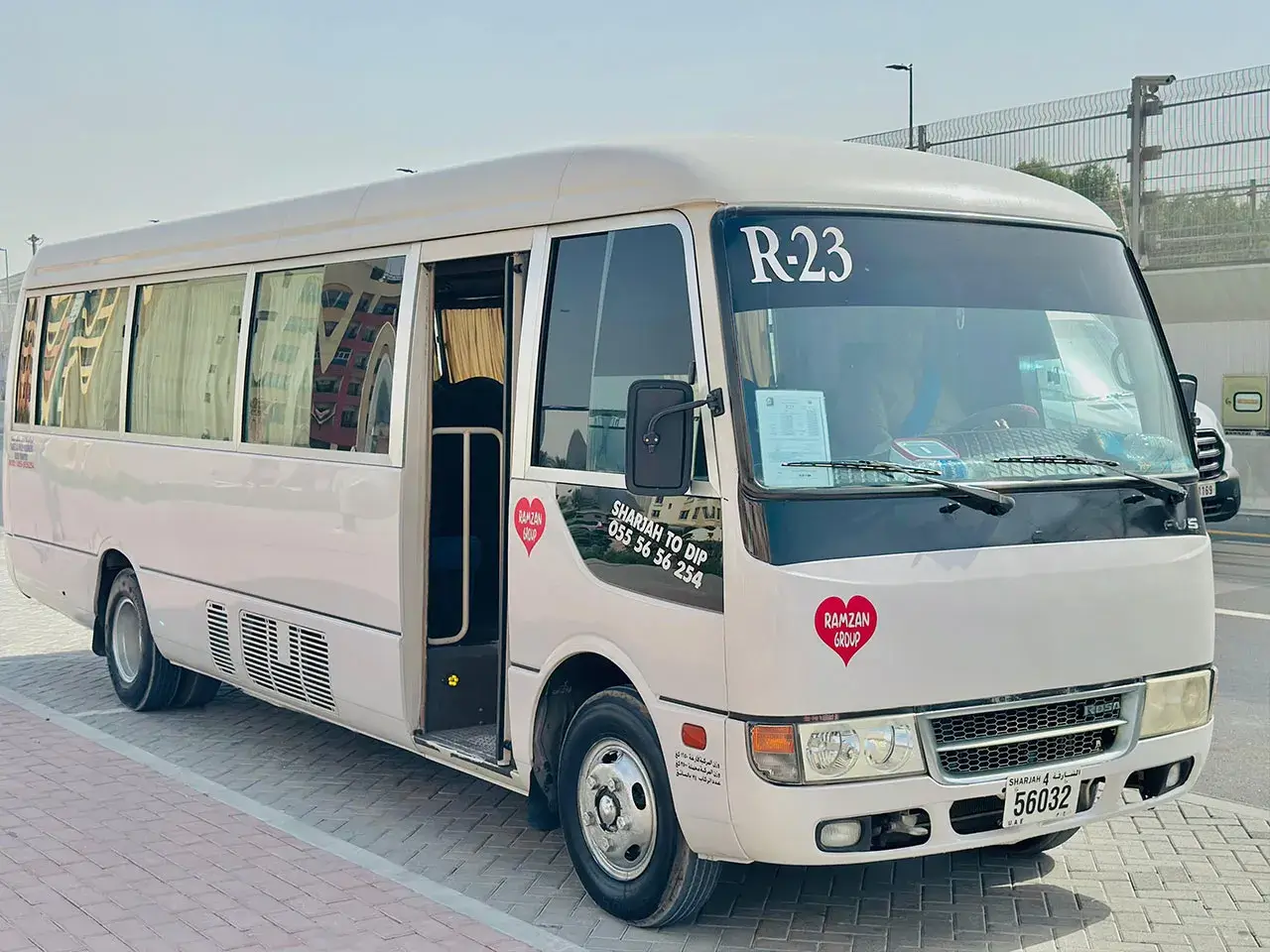 Fleet of Ramzan Group Coaster vans lined up in Sharjah depot
